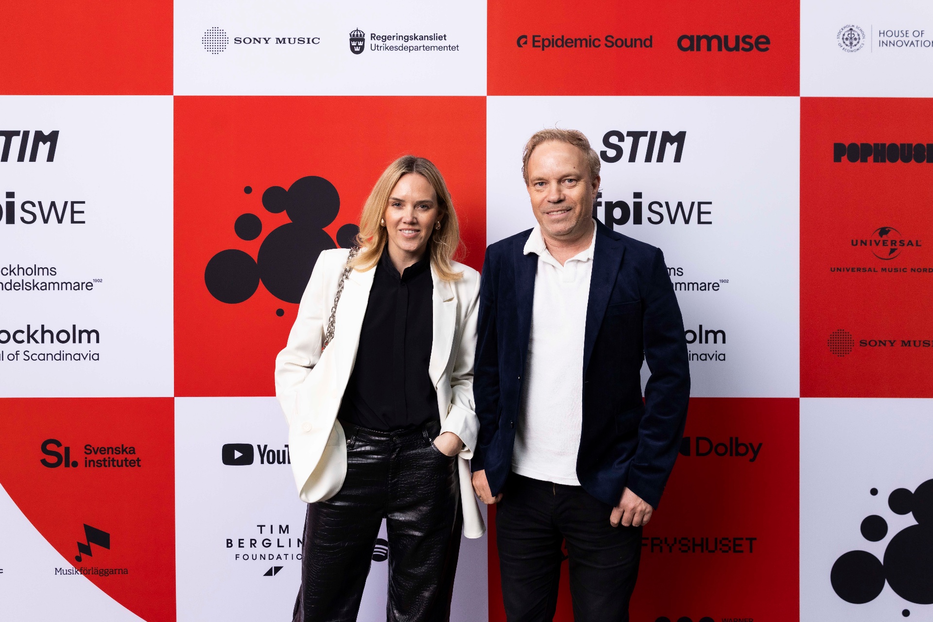 Kim Nyström and Johan Lagerlöf in front of the photo wall