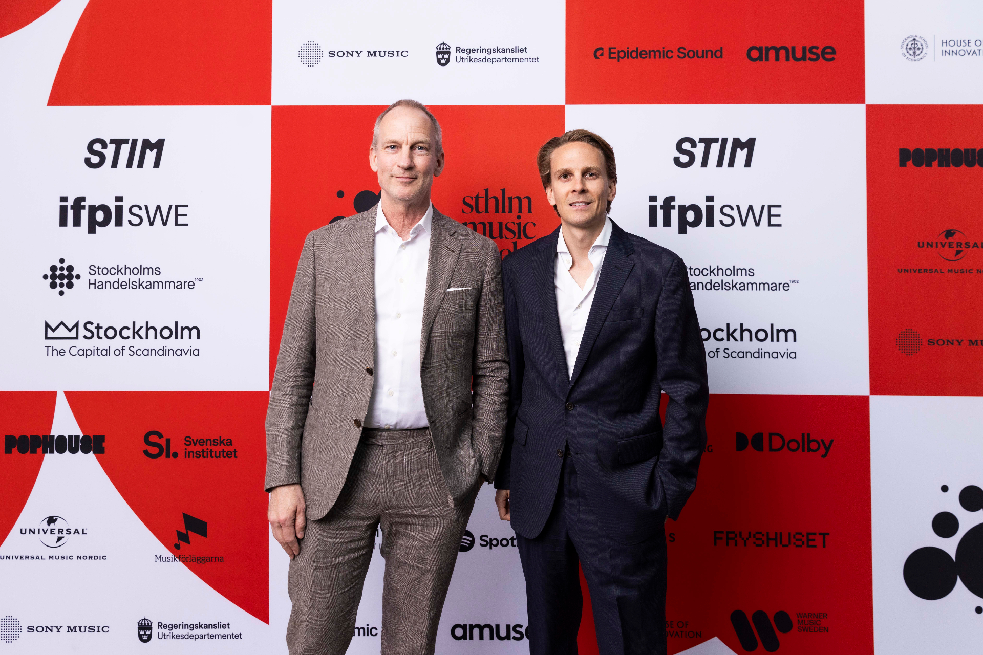 Ludvig Werner and Christopher Thordson in front of the photo wall